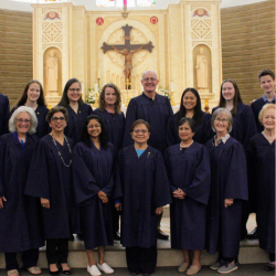 members of the Parish Choir standing in the church