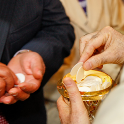 minister distributing holy communion